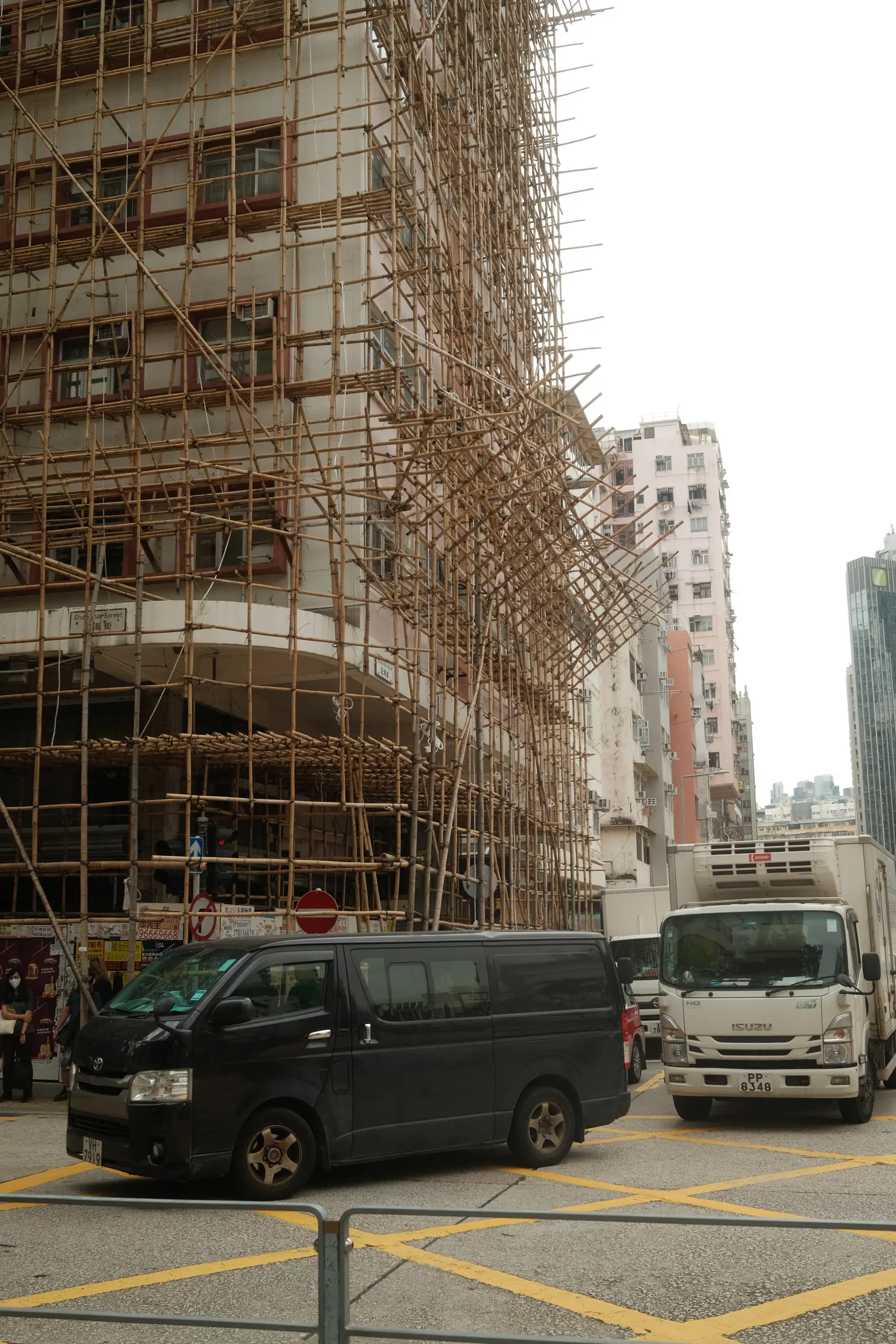 Bamboo scaffolding around a tower under construction
