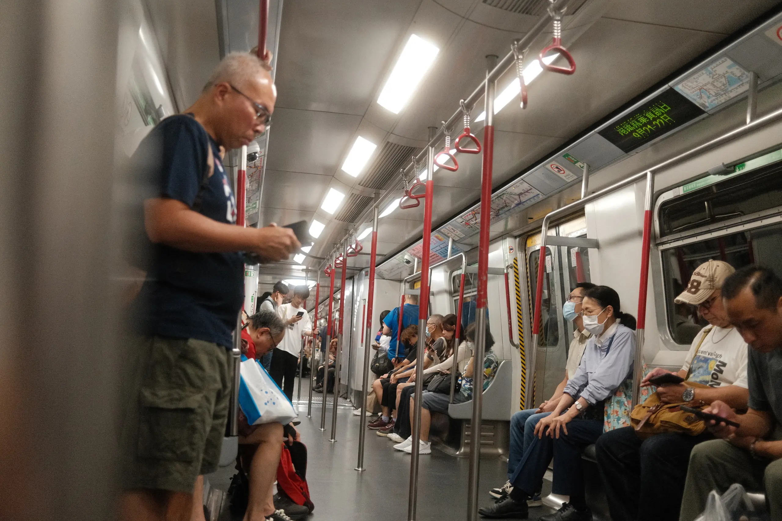 Passengers on an MTR train to Lantau