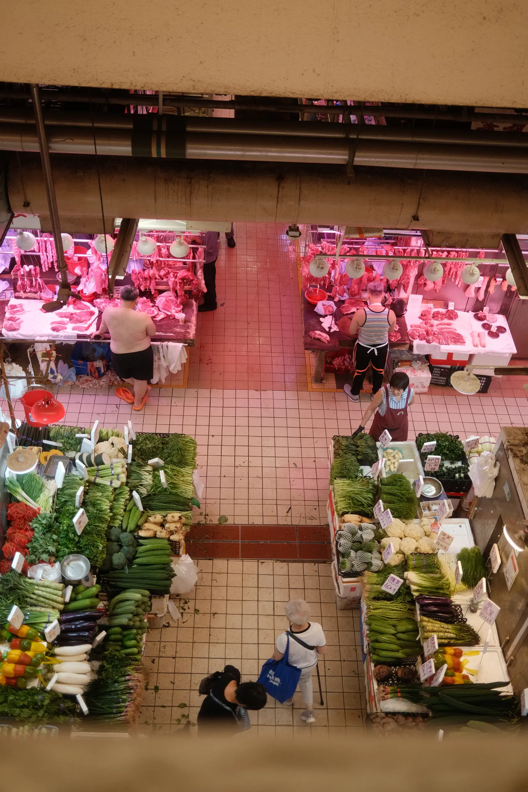 A vegetable stall seen from the floor above