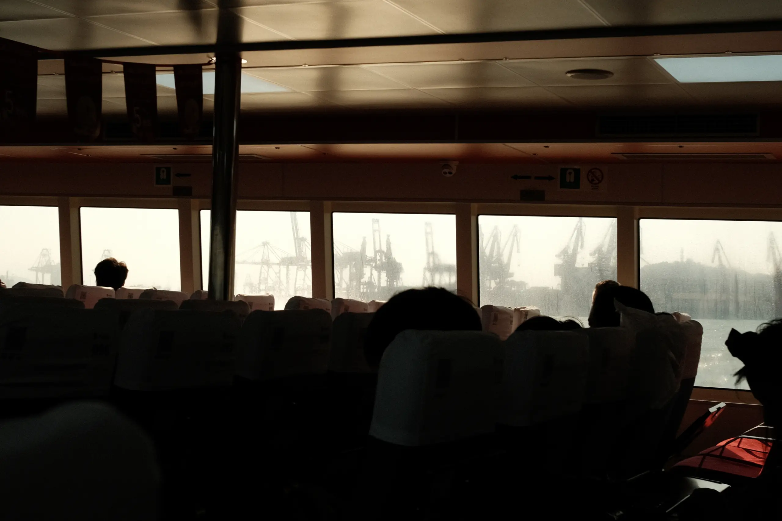 Port cranes seen through the windows of the Shekou ferry