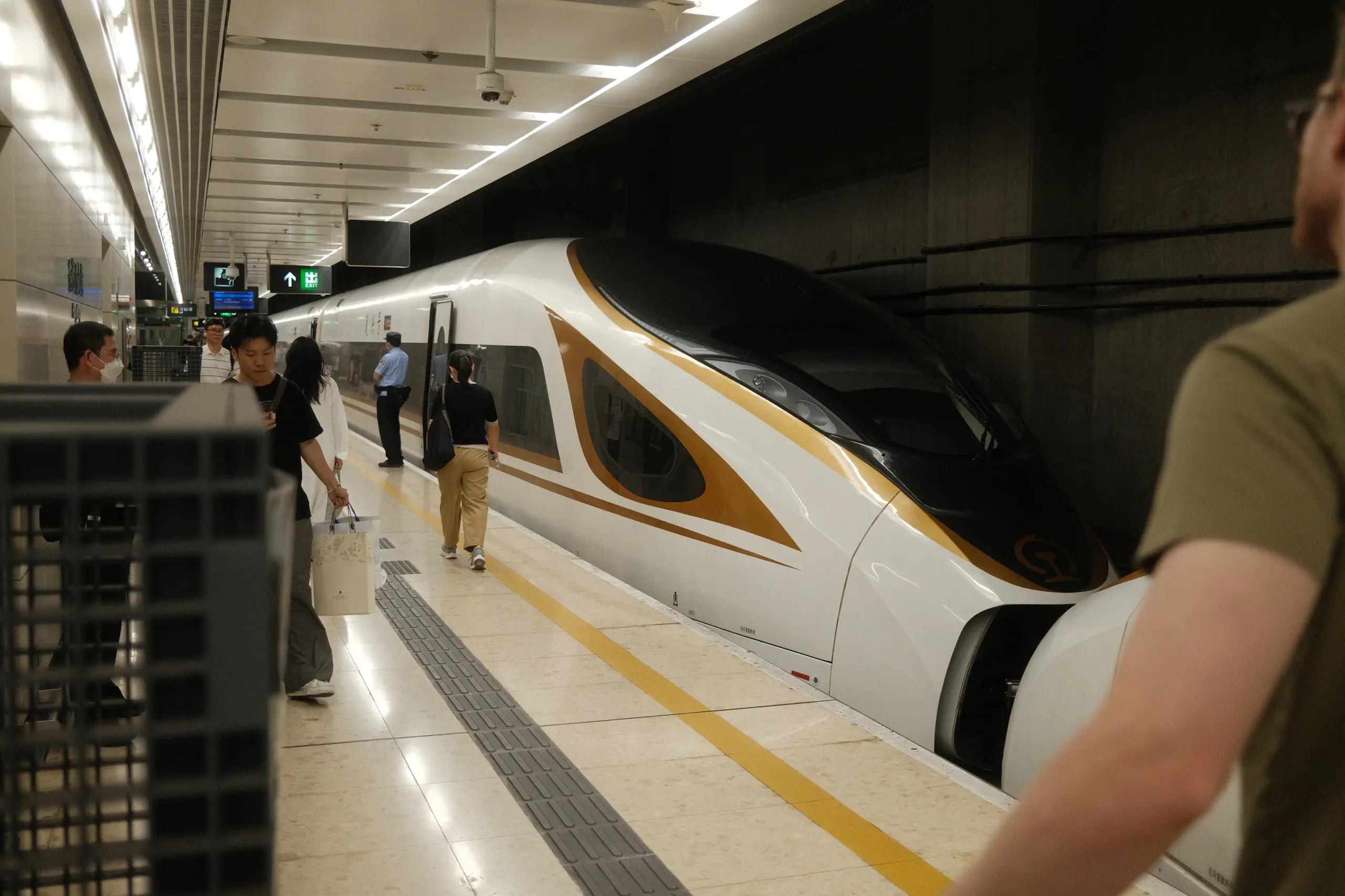 A high-speed train waiting at the platform