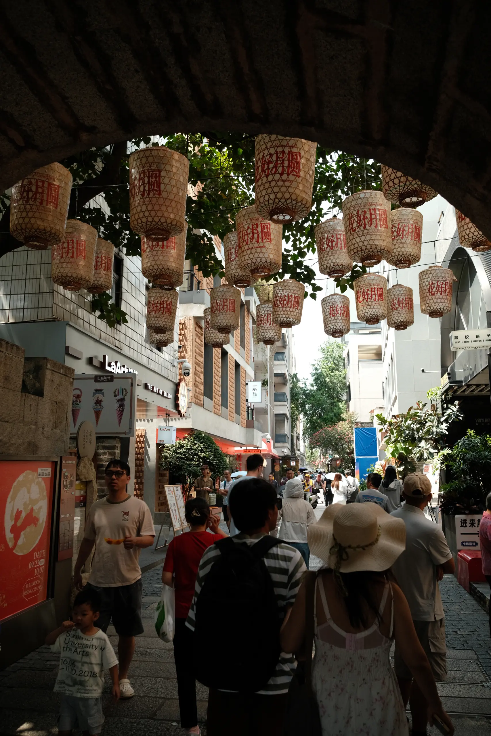Lanterns hanging over a crowded lane in Nantou