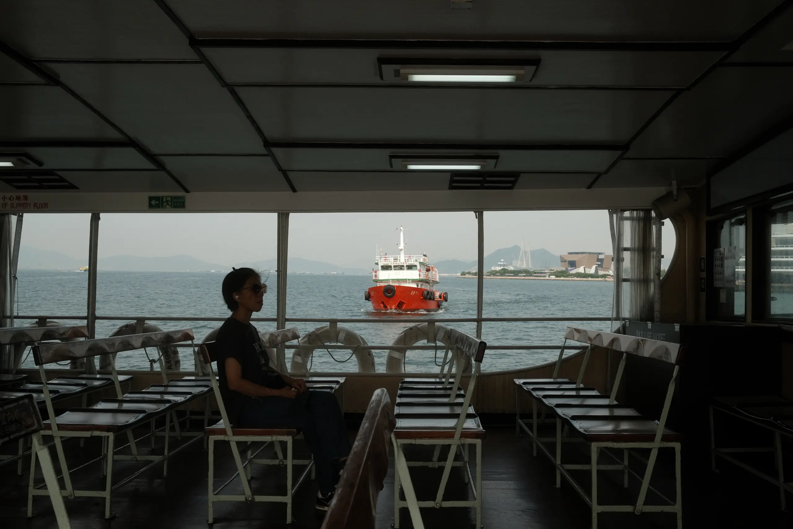 The empty wooden benches of the Star Ferry