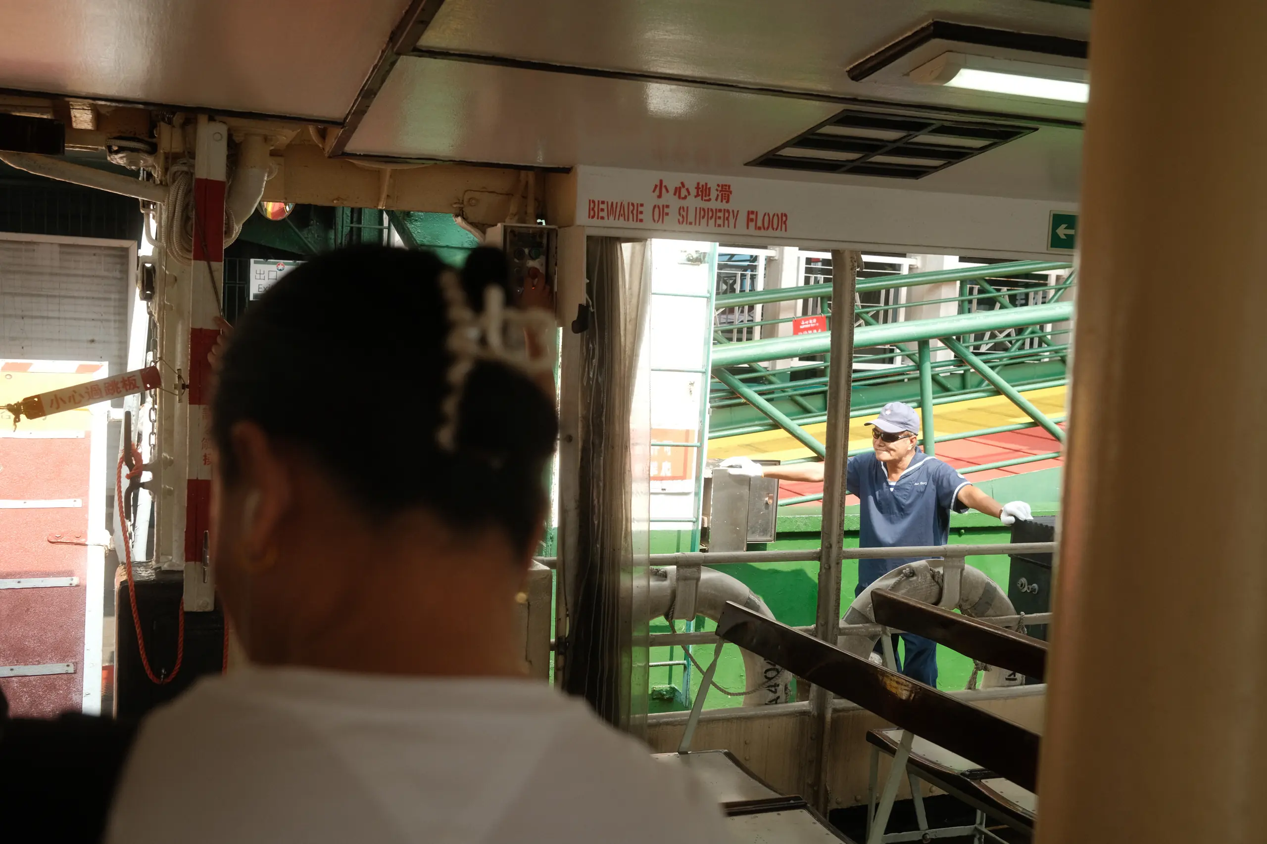 A passenger on the Star Ferry looking out at the harbour