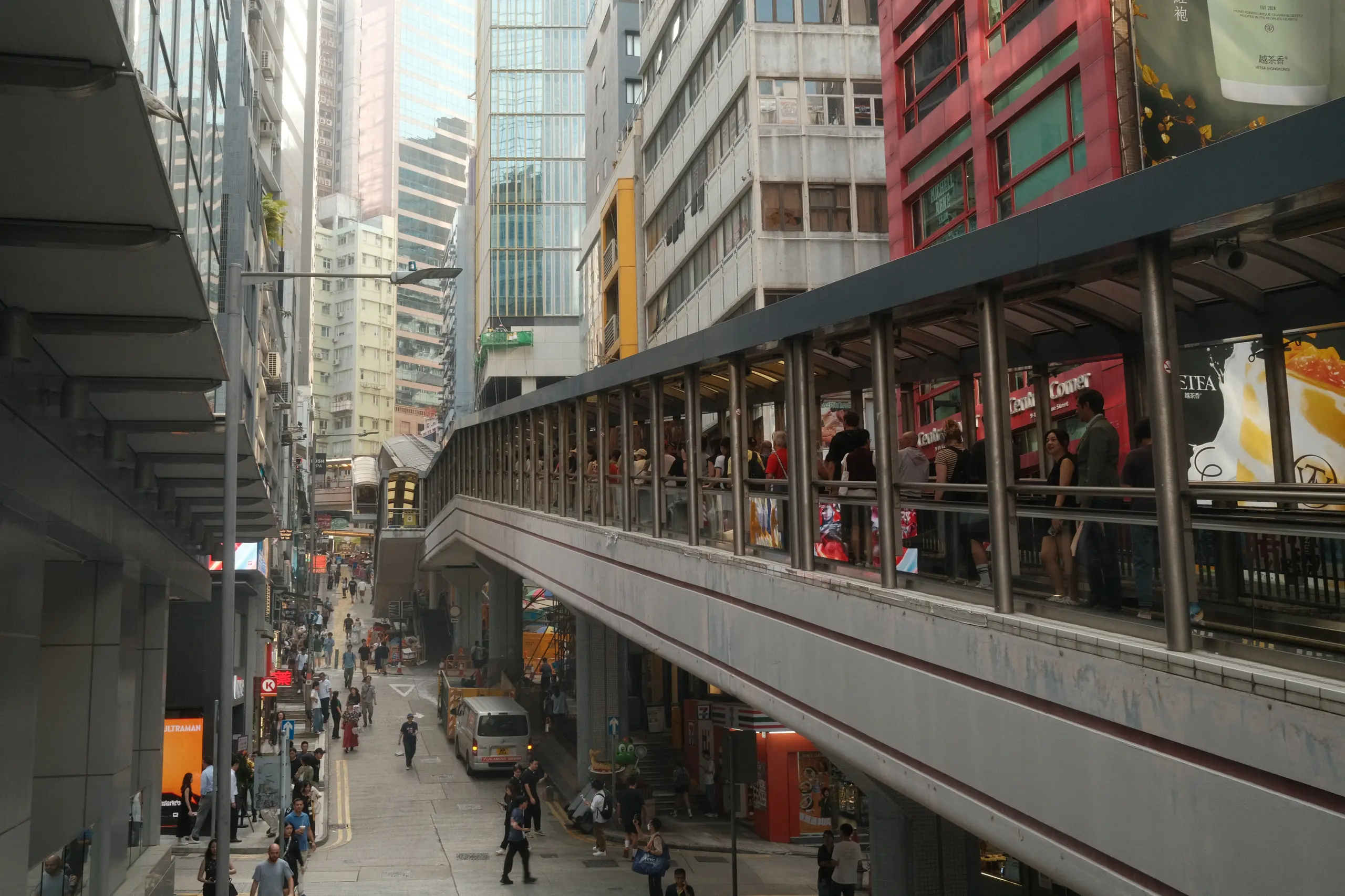 A covered walkway running above a street in Central